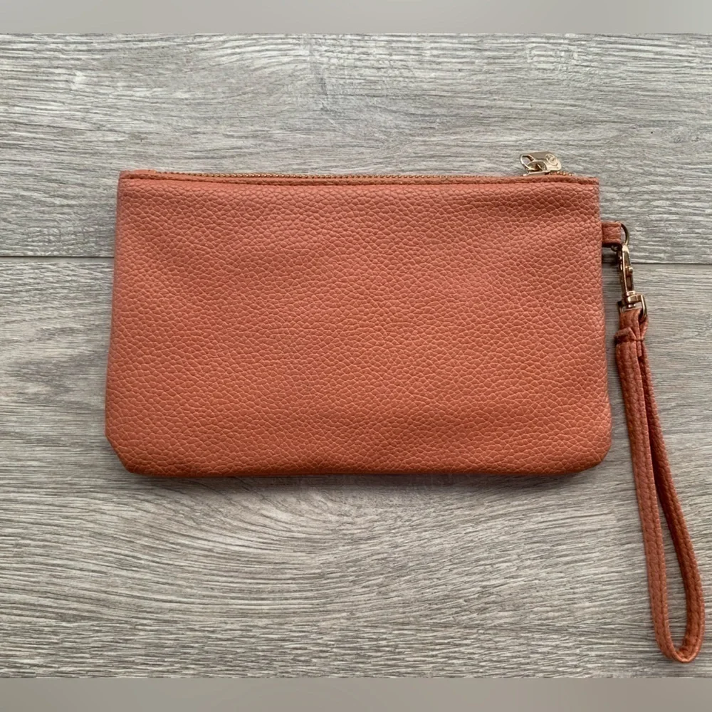 Adrienne Vittadini Studio Charging Wallet Wristlet in Peachy Pink Color